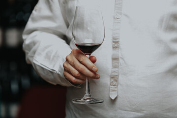 Red wine by the glass at a tasting of white, rosé and red wines that celebrates friendship and joy at the highest level with your best friends on a weekend evening full of people from social media.
