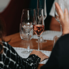 Red wine by the glass at a tasting of white, rosé and red wines that celebrates friendship and joy at the highest level with your best friends on a weekend evening full of people from social media.