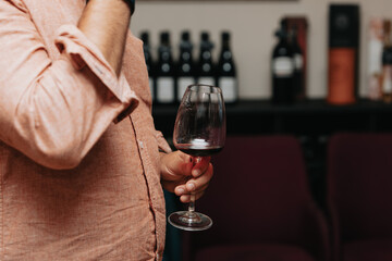 Red wine by the glass at a tasting of white, rosé and red wines that celebrates friendship and joy at the highest level with your best friends on a weekend evening full of people from social media.