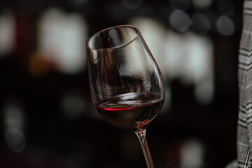Red wine by the glass at a tasting of white, rosé and red wines that celebrates friendship and joy at the highest level with your best friends on a weekend evening full of people from social media.