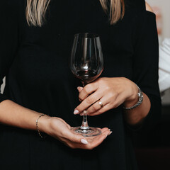 Red wine by the glass at a tasting of white, rosé and red wines that celebrates friendship and joy at the highest level with your best friends on a weekend evening full of people from social media.