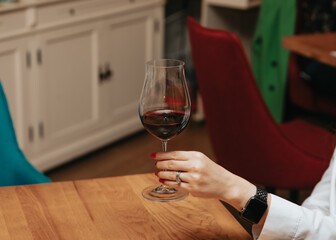 Red wine by the glass at a tasting of white, rosé and red wines that celebrates friendship and joy at the highest level with your best friends on a weekend evening full of people from social media.