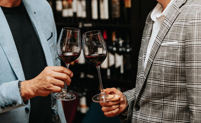 Red wine by the glass at a tasting of white, rosé and red wines that celebrates friendship and joy at the highest level with your best friends on a weekend evening full of people from social media.