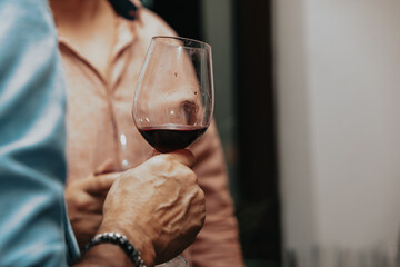 Red wine by the glass at a tasting of white, rosé and red wines that celebrates friendship and joy at the highest level with your best friends on a weekend evening full of people from social media.