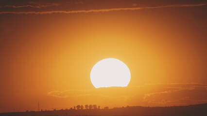 Big sun with clouds. Sunset