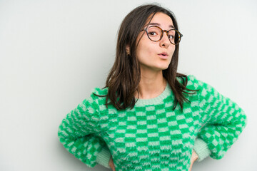 Young caucasian woman isolated on white background being shocked because of something she has seen.