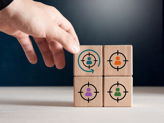 Male hand places wooden cube with retargeting icon. Digital marketing, retargeting, remarketing and...