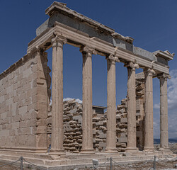 Naklejka premium Erechtheum, the Temple of Athena Polios, an ancient Greek Ionic temple on Acropolis of Athens, dedicated to the goddess Athena, Athens, Greece