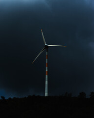 Beautiful windmill in during night with dark-blue sky background. - obrazy, fototapety, plakaty