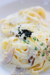 Traditional italian pasta with mushrooms in a restaurant