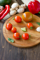 Few Cherry tomatoes on a wooden board
