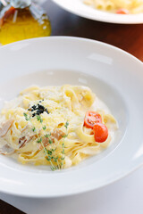 Traditional italian pasta with mushrooms in a restaurant
