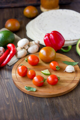 Few Cherry tomatoes on a wooden board