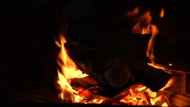 4K video with fire in the fireplace at a mountain cabin. Cozy vibes in the mountains.