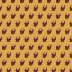  Pattern of roasted chestnuts  on light brown background. 