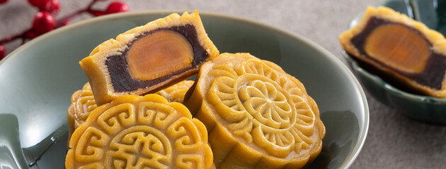 Delicious Cantonese moon cake for Mid-Autumn Festival food mooncake on gray table background.