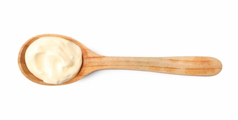 Mayonnaise in wooden spoon isolated on white, top view