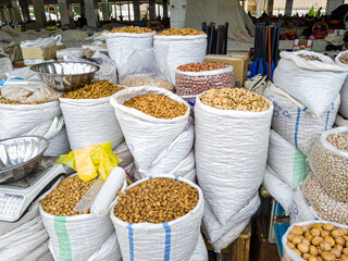 Oriental Bazaar. Almond peeled and unpeeled, nuts sales in market. Dry food, variety almonds in...