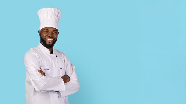 Portrait Of Smiling African American Chef Wearing Uniform Standing With Folded Arms