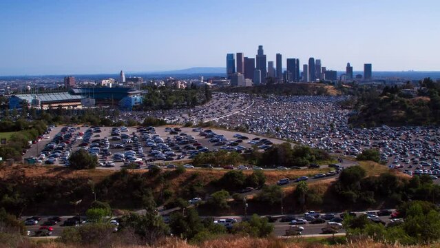 Time Lapse Lockdown Shot Of People Parking Cars In Parking Lot By Dodger Stadium On Sunny Day - Los Angeles, California