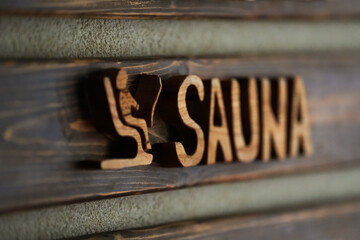 Sauna SPA sign showing the way to the terrace at a mountain luxury resort.