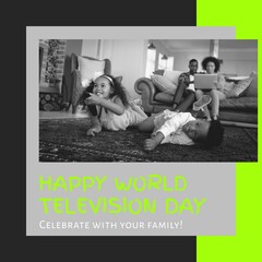 Fototapeta na wymiar Composition of happy world television day text with african american family watching tv