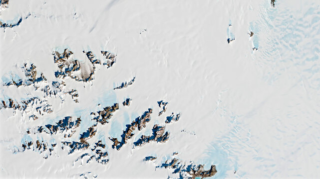 Meteorite in Antarctica, top view of snow rock peaks background texture. Elements of this image furnished by NASA.