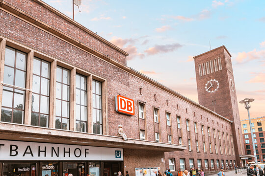 21 July 2022, Dusseldorf, Germany: People and passengers at the entrance of Deutsche Bahn Hauptbahnhof railroad station. Main Railway station transport terminal in the city