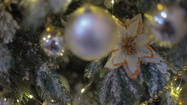 Enlarged image of toys on the Christmas tree. Stylishly decorated Christmas tree. Modern Christmas. New Year.