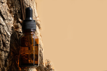 Natural skin care product in amber-colored glass bottle with dropper. Serum for female facial skin....