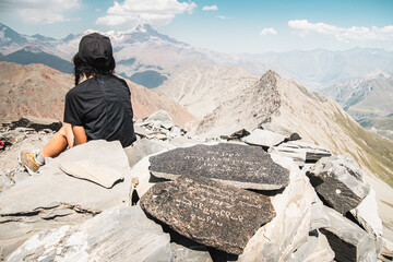Close up aerial view Inspired caucasian hiker woman stand on top mountain enjoy panorama outdoors...