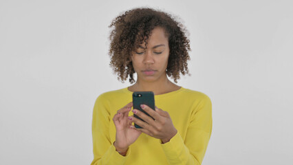 Young African Woman Browsing Smartphone on White Background