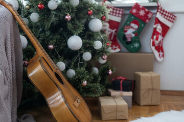 Guitar with decorated Christmas Tree in the background