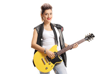 Young woman with an electric guitar
