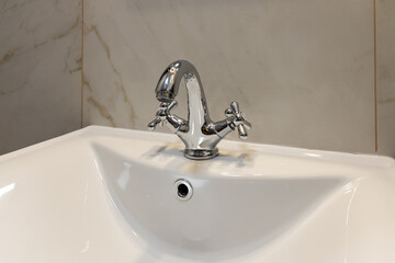 Modern water tap sink with faucet. New home. Interior detail