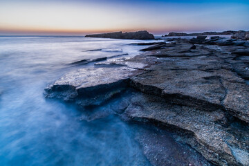 flat rocky coast in cobalt beach at sunset nachsholim Israel