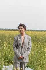 An Asian model poses in a field of yellow flowers for a clothing brand, polyethylene is the main...