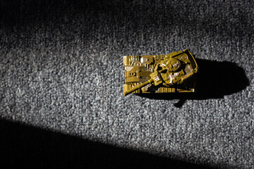 Toy tank with camouflage color. Military vehicles toy. Simple cheap toys for children, warfare, warzone vehicles