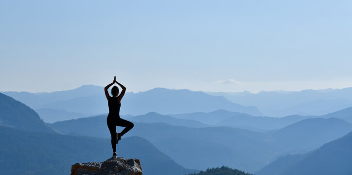 Woman Practicing Yoga in a Wonderful Landscape