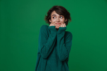 Young white woman smiling while posing with clenched fists