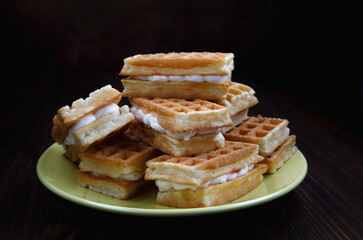 Viennese waffles on a yellow plate. Plate with waffles.