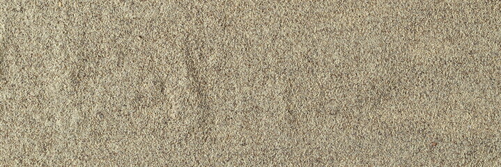 Milled white pepper powder pile, peppercorn background and texture