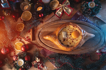 traditional georgian adjarian khachapuri with suluguni cheese, egg yolk, butter