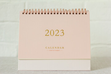 Desktop calendar for the new year 2023 on the table.