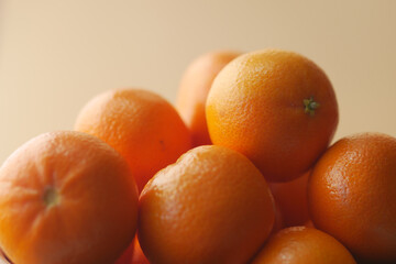 close up of slice of orange fruits in a bowl 