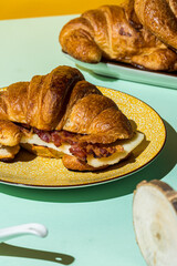 Croissant sandwich with cheese and bacon