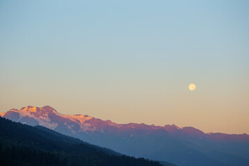 mountain landscape with moon on blue sky