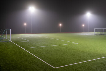 Fototapeta na wymiar Image of soccer field in night with spotlight