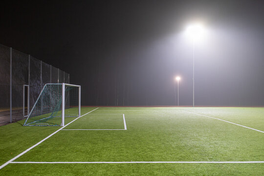 Image of soccer field in night with spotlight