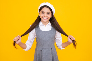 Happy face, positive and smiling emotions of teenager girl. Cute young teenager girl against a isolated background. Studio portrait of pretty beautiful child.